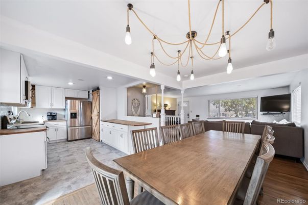 Dining room, Interior, Kitchen, Pendant Lights, Recessed Lighting, Stainless Steel Appliances, Wood Texture Flooring