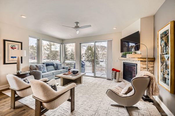 Fireplace, Interior, Living room, Recessed Lighting, Stone Walls, Wood Texture Flooring
