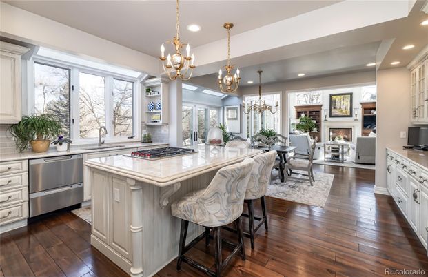 Chandelier, Dining room, Fireplace, Interior, Kitchen, Living room, Pendant Lights, Recessed Lighting, Stainless Steel Appliances, Wood Texture Flooring