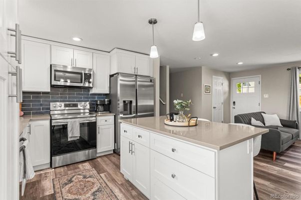Interior, Kitchen, Pendant Lights, Recessed Lighting, Stainless Steel Appliances, Wood Texture Flooring