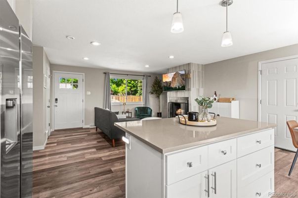 Fireplace, Interior, Kitchen, Pendant Lights, Recessed Lighting, Stainless Steel Appliances, Wood Texture Flooring