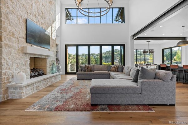 Dining room, Fireplace, Interior, Living room, Pendant Lights, Recessed Lighting, Stone Walls, Wood Texture Flooring