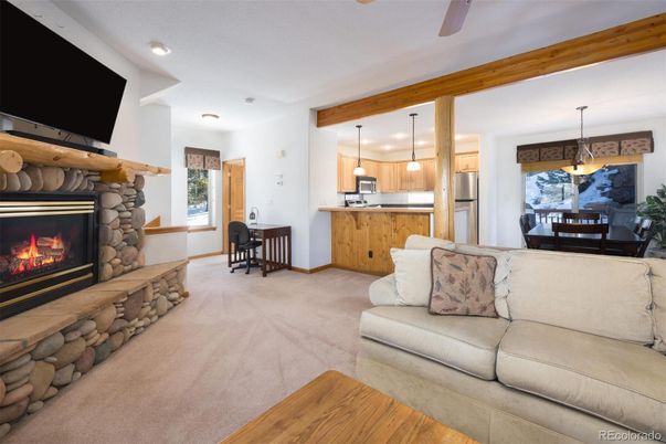 Dining room, Fireplace, Interior, Kitchen, Living room, Pendant Lights, Recessed Lighting, Stainless Steel Appliances, Wood Texture Flooring