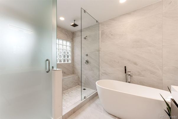 Bathroom, Free Standing Baths, Glass Shower, Interior, Marble Walls, Recessed Lighting