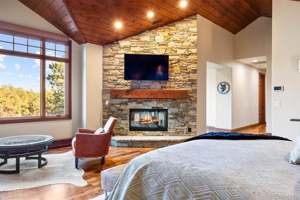 Bedroom, Fireplace, Interior, Recessed Lighting, Stone Walls, Wooden Ceilings, Wood Texture Flooring