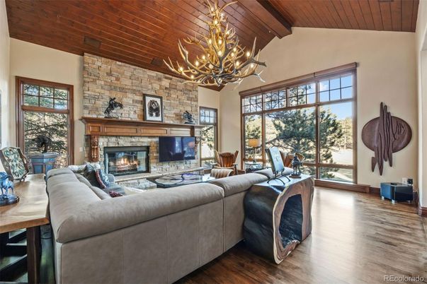 Chandelier, Fireplace, Interior, Living room, Stone Walls, Wooden Beams, Wooden Ceilings, Wood Texture Flooring