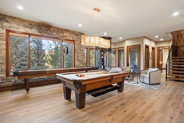 Billiard Table, Chandelier, Game Room, Interior, Recessed Lighting, Stone Walls, Wood Texture Flooring
