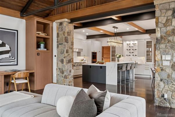 Chandelier, Interior, Kitchen, Living room, Pendant Lights, Recessed Lighting, Stainless Steel Appliances, Stone Walls, Wooden Beams, Wooden Ceilings, Wood Texture Flooring