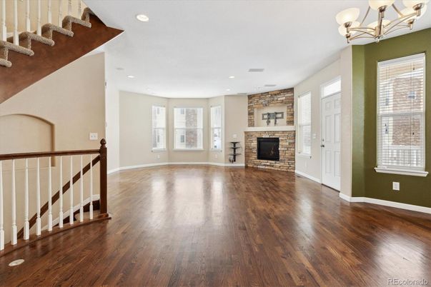 Chandelier, Empty room, Fireplace, Interior, Recessed Lighting, Wood Texture Flooring