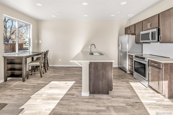 Dining room, Interior, Kitchen, Recessed Lighting, Stainless Steel Appliances, Wood Texture Flooring