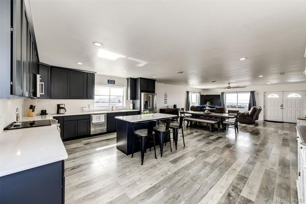 Dining room, Interior, Kitchen, Recessed Lighting, Stainless Steel Appliances, Wood Texture Flooring