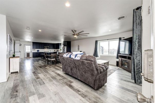 Dining room, Fireplace, Interior, Kitchen, Living room, Recessed Lighting, Wood Texture Flooring