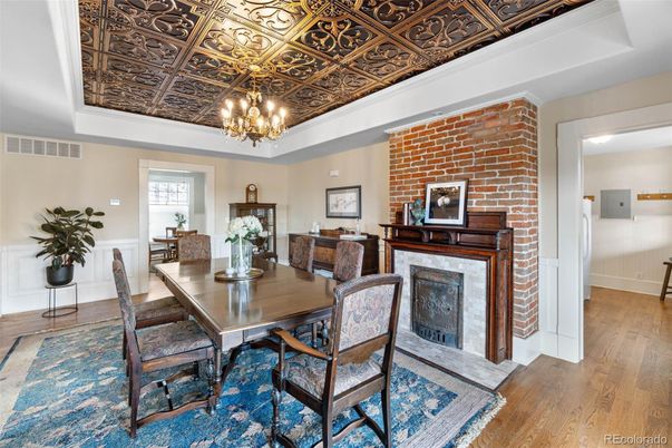 Chandelier, Dining room, Fireplace, Interior, Stone Walls, Wood Texture Flooring