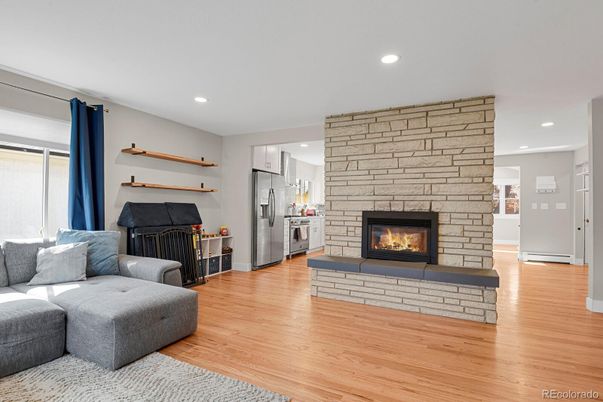 Fireplace, Interior, Kitchen, Living room, Recessed Lighting, Stone Walls, Wood Texture Flooring