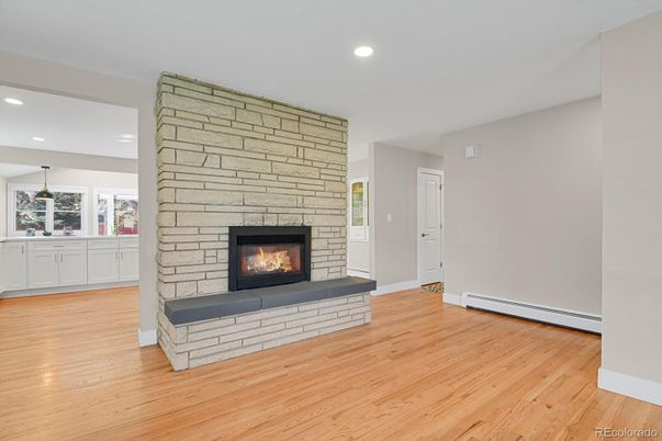 Empty room, Fireplace, Interior, Recessed Lighting, Stone Walls, Wood Texture Flooring