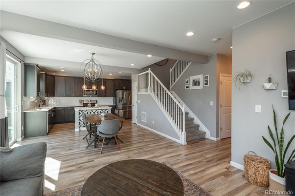Chandelier, Dining room, Interior, Kitchen, Recessed Lighting, Stainless Steel Appliances, Wood Texture Flooring