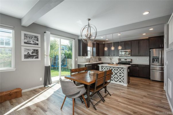 Chandelier, Dining room, Interior, Kitchen, Pendant Lights, Recessed Lighting, Stainless Steel Appliances, Wood Texture Flooring