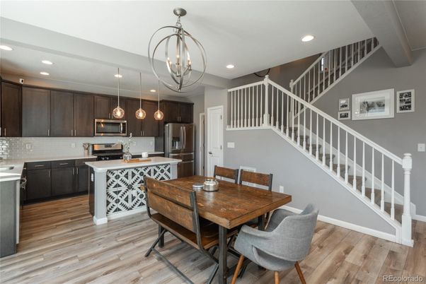 Chandelier, Dining room, Interior, Kitchen, Pendant Lights, Recessed Lighting, Stainless Steel Appliances, Wood Texture Flooring