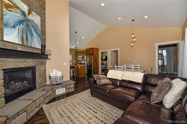 Dining room, Fireplace, Interior, Kitchen, Living room, Pendant Lights, Recessed Lighting, Stainless Steel Appliances, Wood Texture Flooring