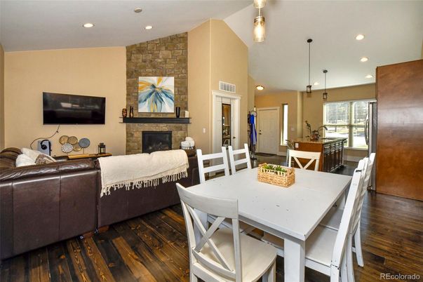 Dining room, Fireplace, Interior, Living room, Pendant Lights, Recessed Lighting, Stone Walls, Wood Texture Flooring