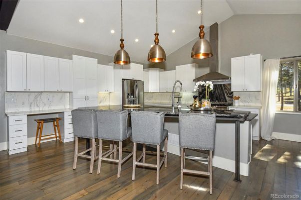 Interior, Kitchen, Marble Walls, Pendant Lights, Recessed Lighting, Stainless Steel Appliances, Wood Texture Flooring