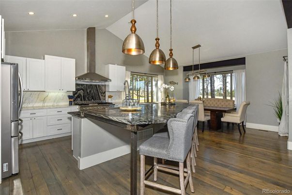 Dining room, Interior, Kitchen, Pendant Lights, Recessed Lighting, Stainless Steel Appliances, Wood Texture Flooring