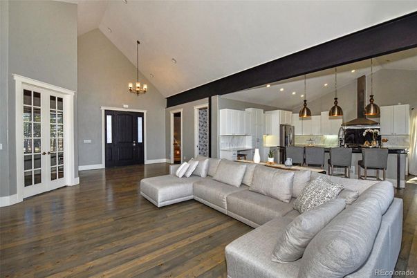 Chandelier, Interior, Kitchen, Living room, Pendant Lights, Recessed Lighting, Stainless Steel Appliances, Wood Texture Flooring
