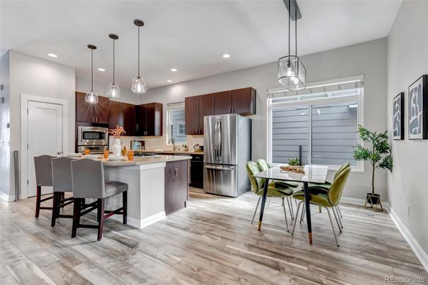 Dining room, Interior, Kitchen, Pendant Lights, Recessed Lighting, Stainless Steel Appliances, Wood Texture Flooring