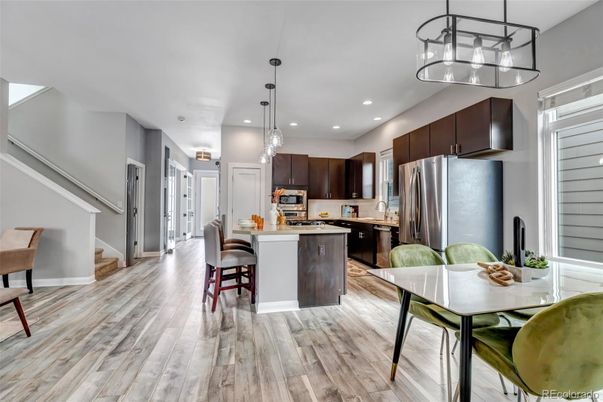 Dining room, Interior, Kitchen, Pendant Lights, Recessed Lighting, Stainless Steel Appliances, Wood Texture Flooring