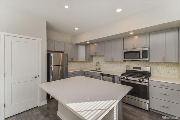 Interior, Kitchen, Recessed Lighting, Stainless Steel Appliances, Wood Texture Flooring