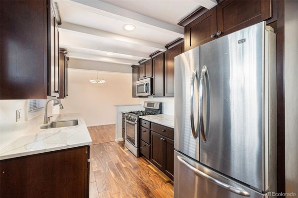 Chandelier, Interior, Kitchen, Recessed Lighting, Stainless Steel Appliances, Wood Texture Flooring