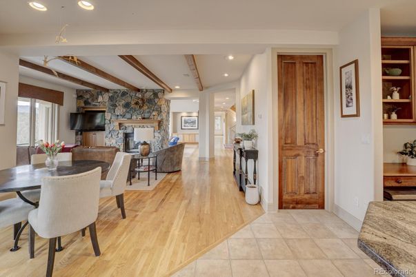 Dining room, Fireplace, Interior, Living room, Recessed Lighting, Wooden Beams, Wood Texture Flooring