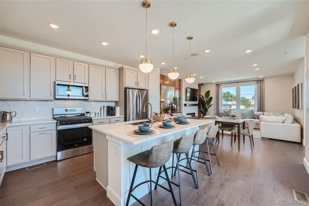 Dining room, Interior, Kitchen, Living room, Pendant Lights, Recessed Lighting, Stainless Steel Appliances, Wood Texture Flooring