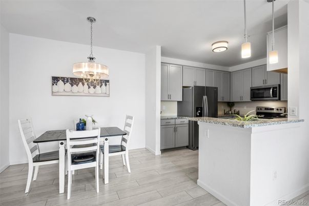 Dining room, Interior, Kitchen, Pendant Lights, Stainless Steel Appliances, Wood Texture Flooring