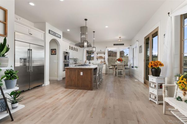 Dining room, Interior, Kitchen, Pendant Lights, Recessed Lighting, Stainless Steel Appliances, Wood Texture Flooring