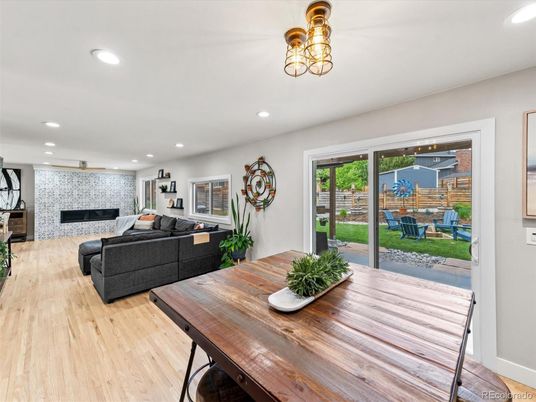 Dining room, Fireplace, Interior, Living room, Recessed Lighting, Wood Texture Flooring
