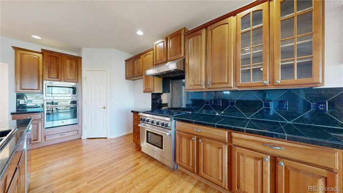 Interior, Kitchen, Recessed Lighting, Tile Countertops, Wood Texture Flooring