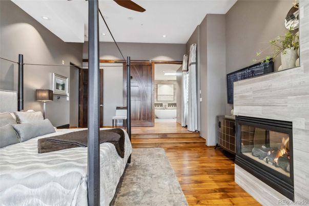 Bedroom, Fireplace, Interior, Recessed Lighting, Wood Texture Flooring
