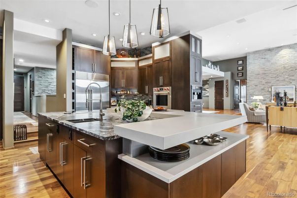 Dining room, Interior, Kitchen, Living room, Pendant Lights, Recessed Lighting, Stainless Steel Appliances, Stone Walls, Wood Texture Flooring
