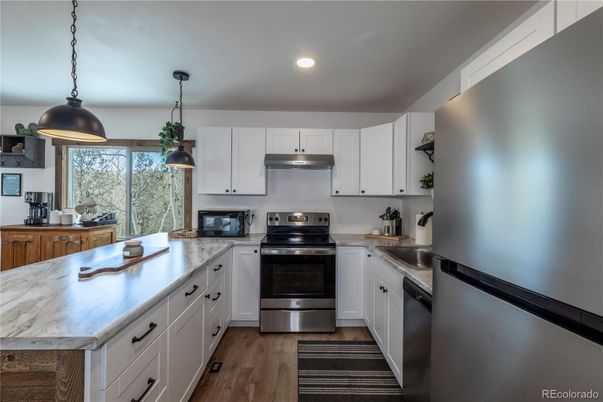 Interior, Kitchen, Pendant Lights, Recessed Lighting, Stainless Steel Appliances, Wood Texture Flooring