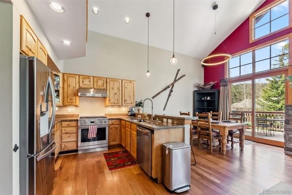 Dining room, Interior, Kitchen, Pendant Lights, Recessed Lighting, Stainless Steel Appliances, Wood Texture Flooring