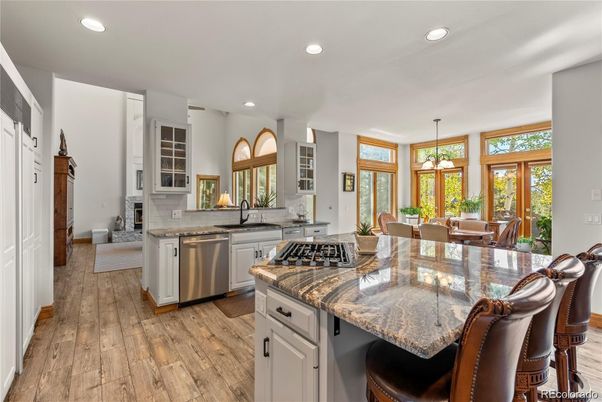 Dining room, Interior, Kitchen, Pendant Lights, Recessed Lighting, Stainless Steel Appliances, Wood Texture Flooring