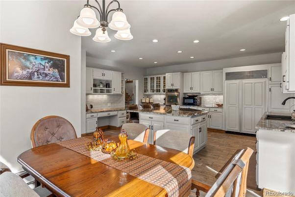 Dining room, Interior, Kitchen, Recessed Lighting, Stainless Steel Appliances, Wood Texture Flooring