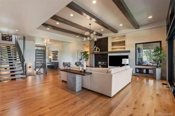 Chandelier, Fireplace, Interior, Living room, Pendant Lights, Recessed Lighting, Wooden Beams, Wood Texture Flooring