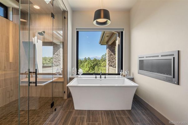Bathroom, Free Standing Baths, Glass Shower, Interior, Pendant Lights, Recessed Lighting, Wood Texture Flooring