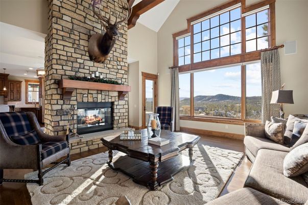 Fireplace, Interior, Living room, Recessed Lighting, Stone Walls, Wood Texture Flooring