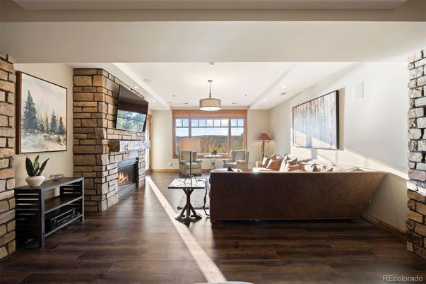 Fireplace, Interior, Living room, Pendant Lights, Recessed Lighting, Stone Walls, Wood Texture Flooring