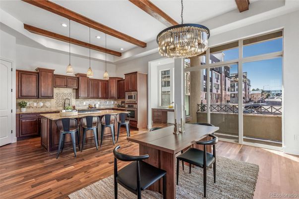 Chandelier, Dining room, Interior, Kitchen, Pendant Lights, Recessed Lighting, Stainless Steel Appliances, Wooden Beams, Wood Texture Flooring