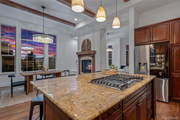 Chandelier, Fireplace, Interior, Kitchen, Pendant Lights, Recessed Lighting, Stainless Steel Appliances, Wooden Beams, Wood Texture Flooring