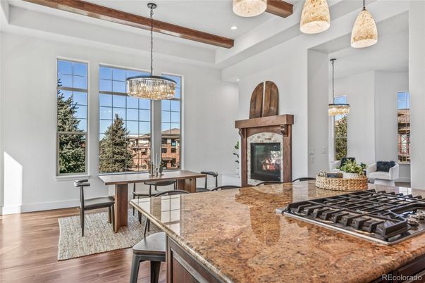 Chandelier, Dining room, Fireplace, Interior, Kitchen, Pendant Lights, Recessed Lighting, Wooden Beams, Wood Texture Flooring